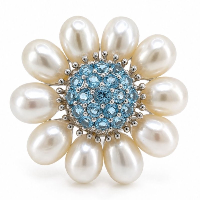 18K White Gold Blue Topaz & Fresh Water Pearl Brooch/Pendant: 18K White Gold Blue Topaz & Fresh Water Pearl Brooch/Pendant Weighing 22.0 gramsSet with app. 5.00 Ct. of Blue TopazAlong with 10 Fresh-water Pearls1.5 inches in length