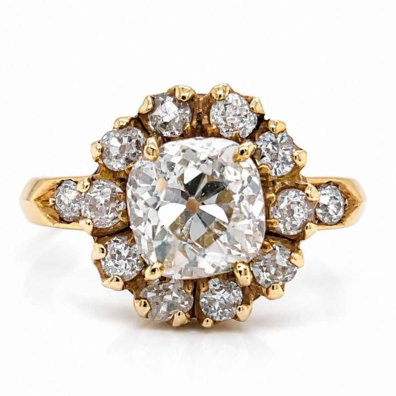 Antique 18K Yellow Gold 2.57 Ct. Diamond Ring: Antique 18K Yellow Gold 2.57 Ct. Diamond Ring Weighing 6.2 gramsSet with a 2.57 Ct. Old Mine Diamond K Color, SI3 ClarityAlong with 12 Old Mine Diamonds weighing app. 1.10 Ct. H-I Color, VS1-SI2 Clari