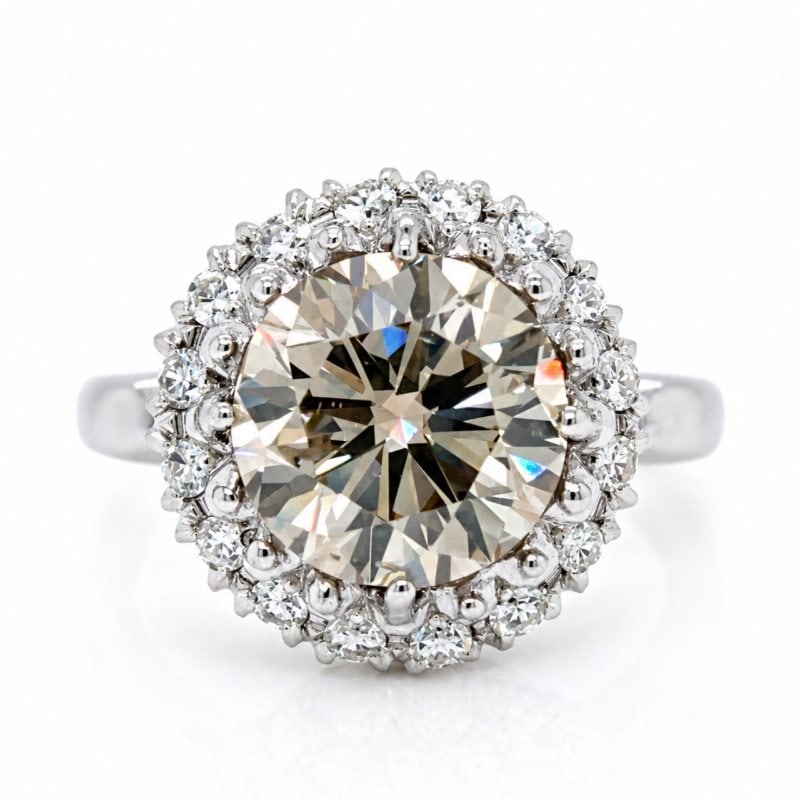 1950’s 14K White Gold 4.89 Ct. IGI Certified Light Brown Diamond Ring: 1950’s 14K White Gold 4.89 Ct. IGI Certified Light Brown Diamond Ring Weighing 6.8 gramsSet with an IGI Certified 4.89 Ct. Round Diamond Light Brown Color, SI2 Clarity 10.59 – 10.81 x 6.65mm IGI #