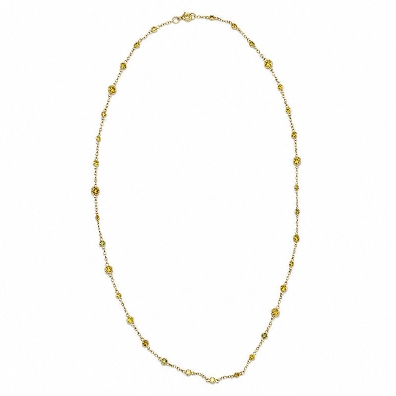 18K Yellow Gold Irradiated Diamond by the Yard Necklace: 18K Yellow Gold Irradiated Diamond by the Yard Necklace Weighing 5.8 gramsSet 34 Irradiated Diamonds weighing app. 5.70 Ct. Fancy Intense Yellow Color, VVS-VS Clarity20 inches in length