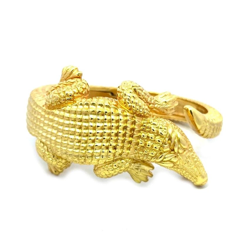 Keiselstein-Cord Alligator Gold Bracelet Kick Band Cuff Style: This bold Keiselstein-Cord Alligator gold bracelet is a stylish and unique piece of authentic jewelry featuring a cuff style design with a detail sculpted full figure alligator. Made of solid yellow g
