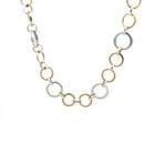 Tiffany & Co. Gold Sterling Silver Necklace 18k Yellow Multi-Ring Link Style: The Tiffany & Co. gold and sterling silver necklace features multi-ring links in silver with smaller yellow gold ring accent. This 18-inch necklace is crafted with 18k yellow gold and sterling silver,