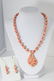 HAND MADE ceramic coral colored beaded necklace and