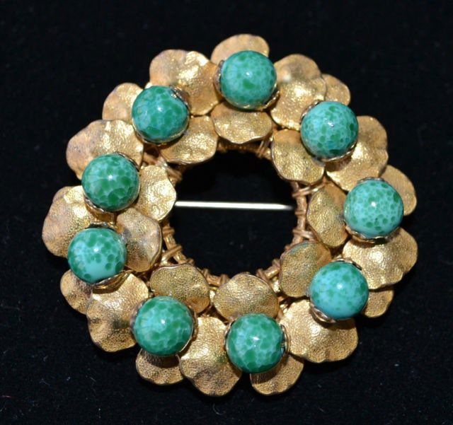 MIRIAM HASKELL VINTAGE CIRCLE PIN *SIGNED*: MIRIAM HASKELL VINTAGE SIGNED CIRCLE PIN OF RUSSIAN GOLD FAUX JADE This elegant Miriam Haskell brooch is made of Russian gold plated flowers with jade-like cabachons as their center. Signed on the bac
