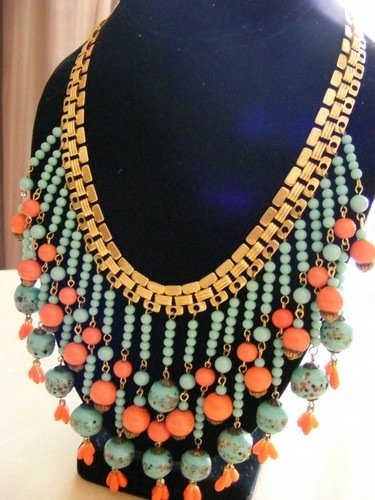 VINTAGE MIRIAM HASKELL EGYPTIAN DROP NECKLACE *SIGNED*: THIS NECKLACE IS MADE IN THE EGYPTIAN REVIVAL STYLE, WITH TURQUOISE AND CORAL COLORED GLASS BEADS. THE CHAIN IS A WIDE GOLDEN COLOR AND IS SIGNED ON THE CLASP " MIRIAM HASKELL ALSO PAT.3427691". NECKL