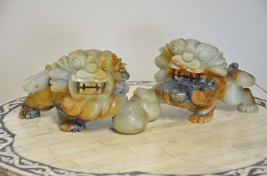 PAIR OF STONE CARVED FOO DOGS: PAIR OF STONE CARVED FOO DOGS. FOO DOGS OR CHINESE GUARDIAN LIONS. THEY ARE BELIEVED TO HAVE POWERFUL PROTECTIVE BENEFITS! APPROX. 6.5 X 10.5 INCHES