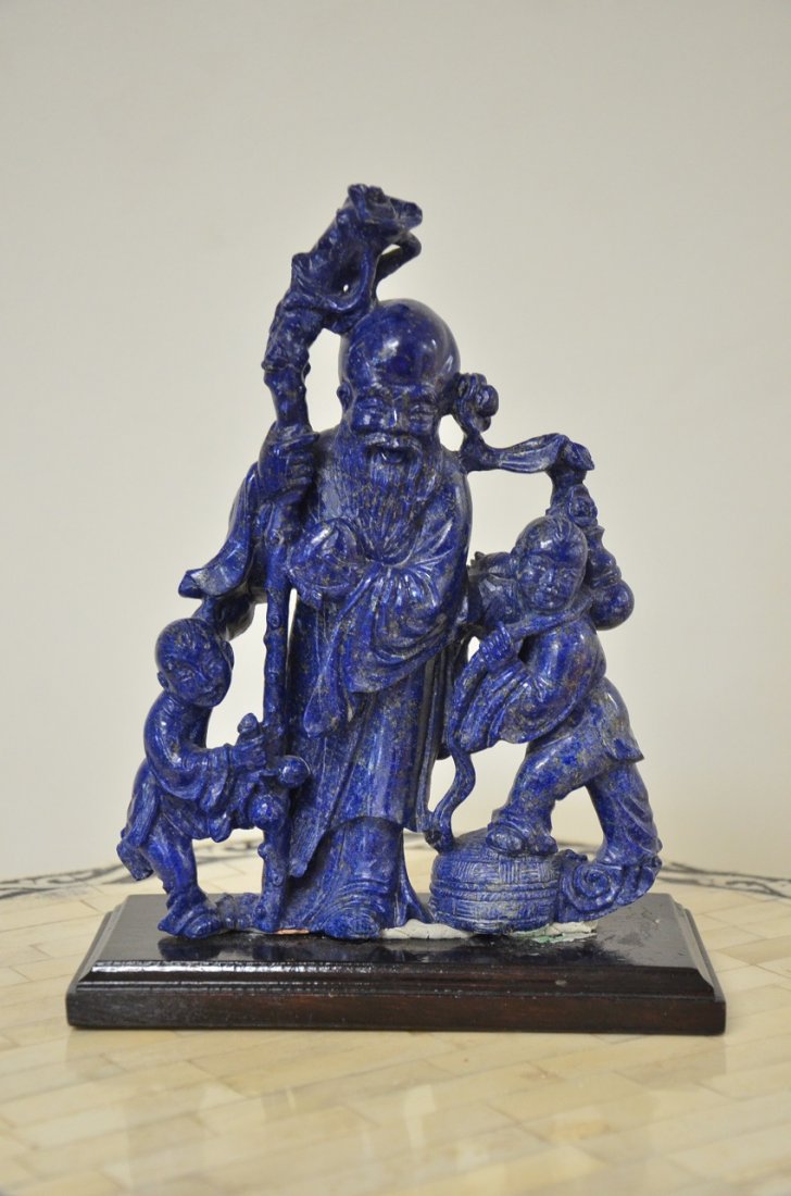 LAPIS CARVED WISE MAN WITH 2 KIDS: LAPIS CARVED WISE MAN WITH 2 KIDS APPROX. 9 X 7 INCHES ON STAND VALUE $1400