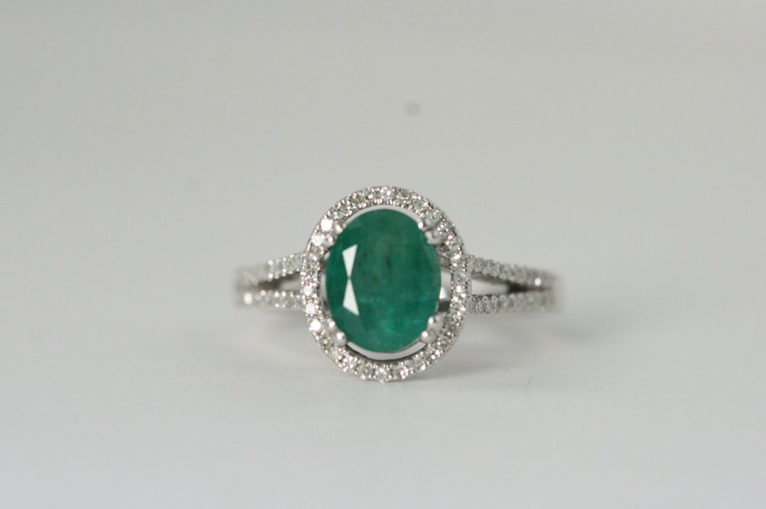 14K W/G RING WITH .50 CT DIAMONDS AND EMERALD.: 14K W/G RING WITH .50 CTS DIAMONDS AND A 9 X 7 MM OVAL CUT EMERALD. VALUE $2950