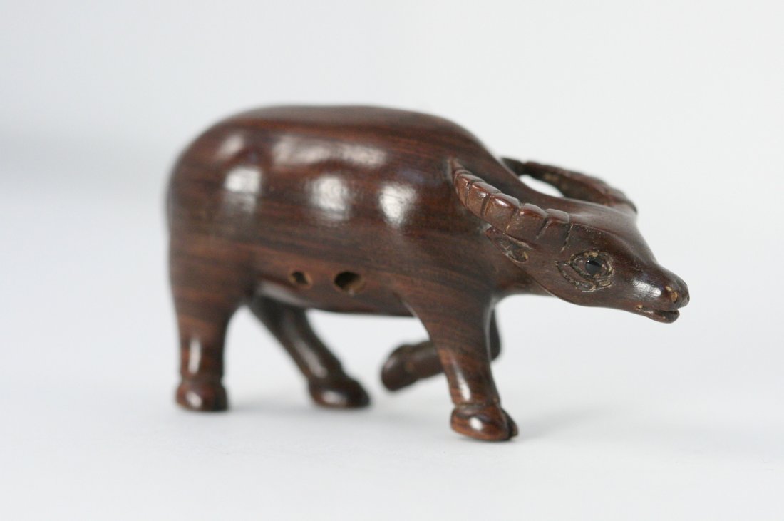 CARVED WOOD NETSUKE OF WATER BUFFALO: CARVED WOOD NETSUKE OF WATER BUFFALO