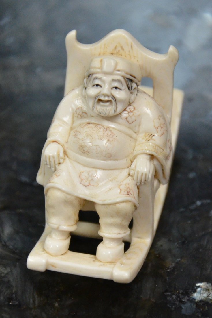 IVORY NETSUKE OF BUDDAH IN ROCKING CHAIR.: ADORABLE IVORY NETSUKE OF BUDDAH IN ROCKING CHAIR. APPROX. 1 X 2.5" VALUE $600