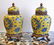 PAIR OF PORCELAIN ORIENTAL URNS ON BRONZE STANDS