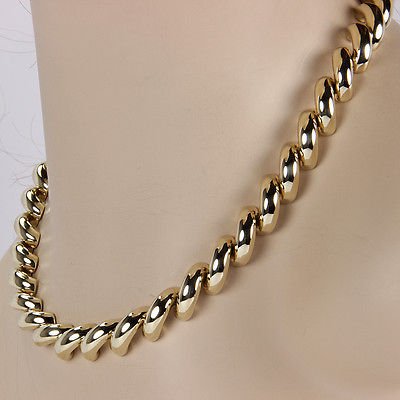 14K Yellow Gold 12mm Italian San Marko Fashion Link: This fine necklace is crafted from solid 14k yellow gold. It features the classic San Marko link design. Its signed on the clasp with Italy andthe gold content.DETAILSMaterial:Solid 14k yellow gold.Me