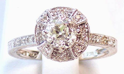 INTRICATE ENGRAVED 18k WG DIAMOND SOLITAIRE RING You: You are viewing a beautiful 18k white gold engraved diamond solitaire engagement ring. This antique style piece features a very intricate shank that is engraved on the sides with a wonderful chevron a
