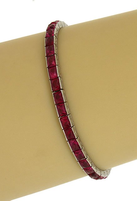 ANTIQUE ART DECO PLATINUM & 16 CTS RUBIES LADIES: This is an antique platinum and rubies ladies engraved bracelet. The piece isÂ exquisitely crafted in solid platinum with a smoothÂ polished finish and intricate engraved accents adorned with 16 c
