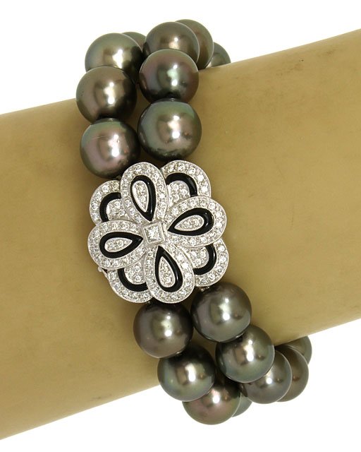 AMAZING 18K WHITE GOLD, 1.3 CTS DIAMONDS & SOUTH SEA: This is an amazing 18k white gold, diamonds and Tahitian pearls ladies dress bracelet. The piece is composed of two strands of lustrous South Sea Tahitian pearls attached to a solid 18k white gold orn