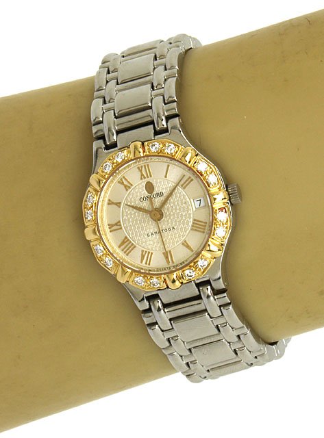 CONCORD SARATOGA 18K, STAINLESS STEEL & DIAMONDS LADIES: This is a designer Concord Saratoga 18k gold, stainless steel and diamonds ladies fine wrist watch. The case is exquisitely crafted in solid stainless steel with a nice rounded form adorned with a sol