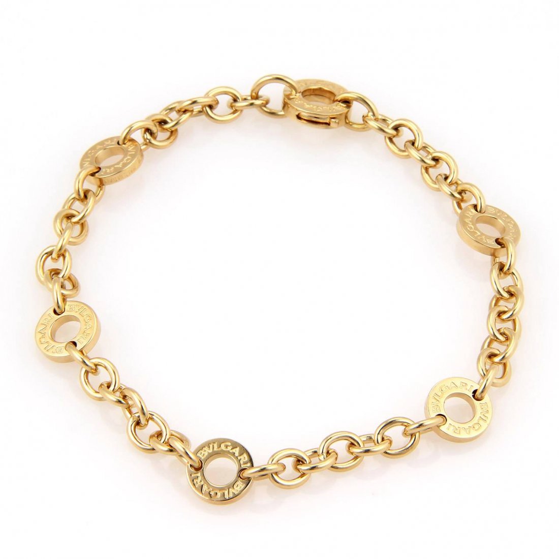Bulgari Authentic Bvlgari Solid 18kt Yellow Gold Open: This is an Elegant Bulgari (Bvlgari) authentic bracelet, it is crafted in solid 18kt yellow gold with seven small oval shape link chain, each chain attached to an open round circle with the "Bvlgari"