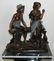 BRONZE MAN & WOMAN SITTING ON MARBLE BASE