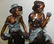 BRONZE MAN & WOMAN SITTING ON MARBLE BASE - 2