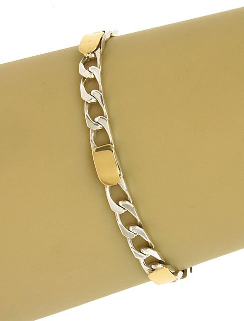 DESIGNER TIFFANY & CO. STERLING SIVLER & 18K GOLD: This is a designer Tiffany & Co. sterling silver and 18k yellow gold ladies chain link bracelet. The piece is exquisitely crafted in solid sterling silver with a smooth high polished finish adorned wi