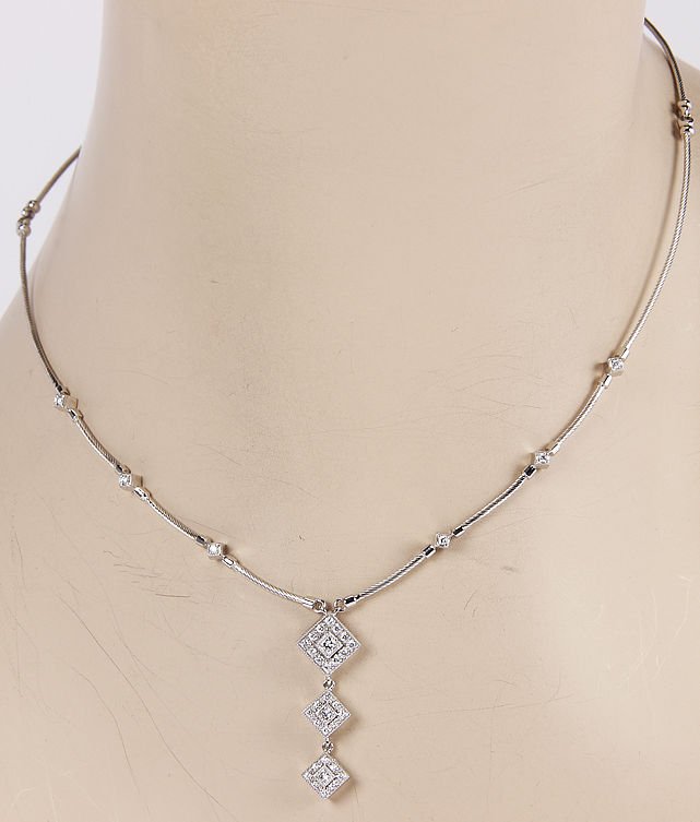 Philippe Charriol 18K White Gold Cable Diamond Pendant: This authentic Philippe Charriol piece is finely crafted from solid 18k white gold. It features a unique cable design along with a stunning diamond dangle pendant. It looks absolutely fabulous on the