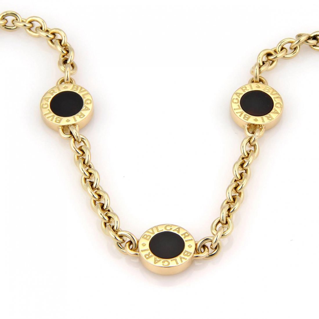 Bulgari "Bvlgari" 18kt Yellow Gold Black Onyx Three: Up for your viewing is a stunning Necklace by Bvlgari, it is crafted in solid 18kt yellow gold and black Onyx, each staion is 13mm stations inset with smooth jet black Onyx and bordered with engraved