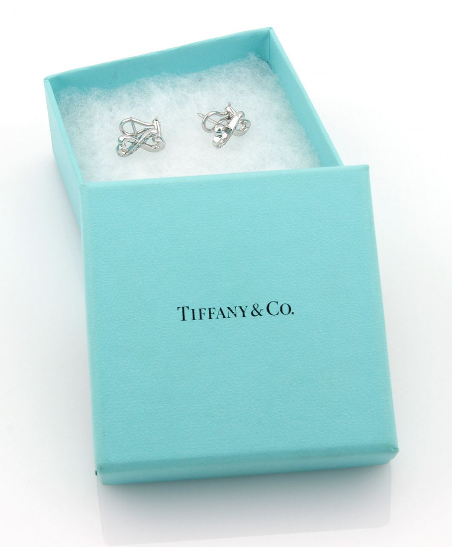 Tiffany & Co. Paloma Picasso 18K White Gold Double: These authentic Tiffany & Co. earrings are finely crafted from solid 18k white gold. They come from Tiffany's ever so popular Loving Heart collection and look absolutely gorgeous on the ear. They are 