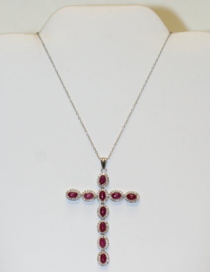 RUBY CROSS SET WITH 10 OVAL CUT RUBIES: BEAUTIFUL RUBY CROSS SET WITH 10 OVAL CUT RUBIES , PRONG SET IN STERLING SILVER. APPX 2.2" X 1.8 ".