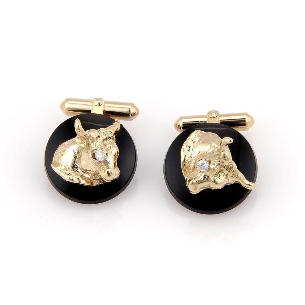 Estate 14K Yellow Gold Bull Head Cufflinks: These fabulous cufflinks are finely crafted from solid 14k yellow gold. They feature a very stylish bull head design along with diamonds and onyx to really give them a distinct look. The gold content 