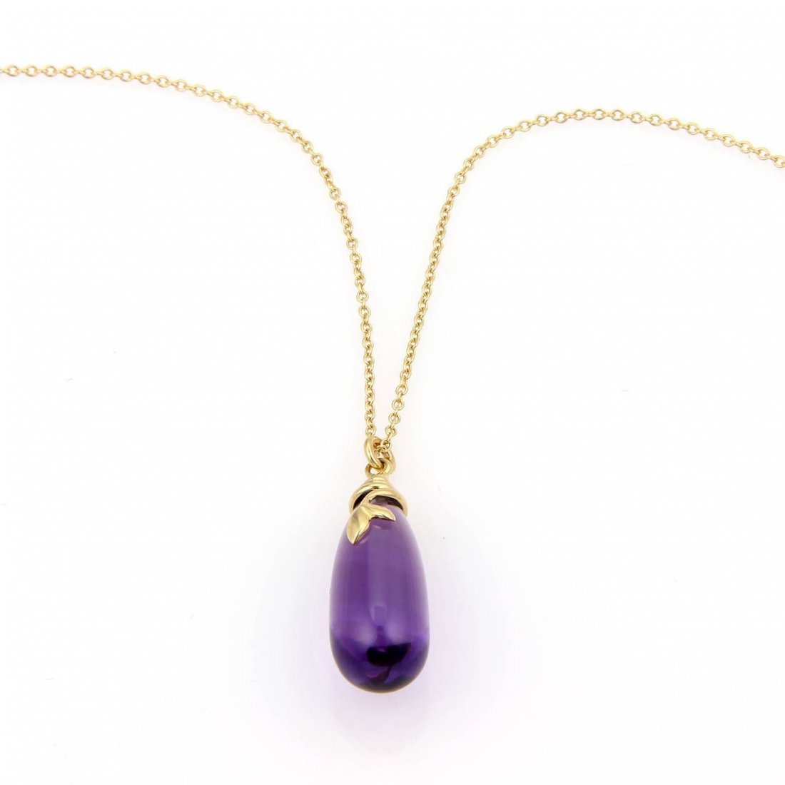 Tiffany & Co. Paloma Picasso 18k Yellow Gold Olive Leaf: A stunning necklace from Tiffany & Co. by designer Paloma Picasso in her popular Olive Leaf collection. With a gold chain crafted in solid 18kt yellow gold and a vibrant translucent bottle shape Ameth