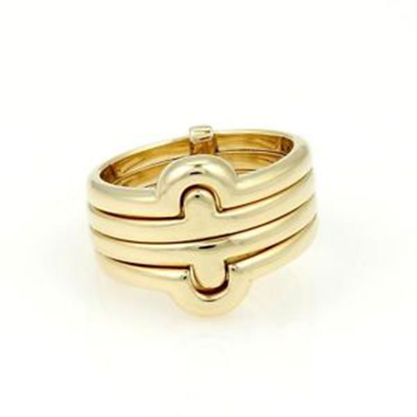Bvlgari Bulgari 18kt Yellow Gold Parentesi Stacking: This is an elegant ring by Bulgari, from the Parentesi collection, it is well crafted in solid 18kt yellow gold with a fine polished finish, with four fitted stacked rings. Very elegant and sophistica