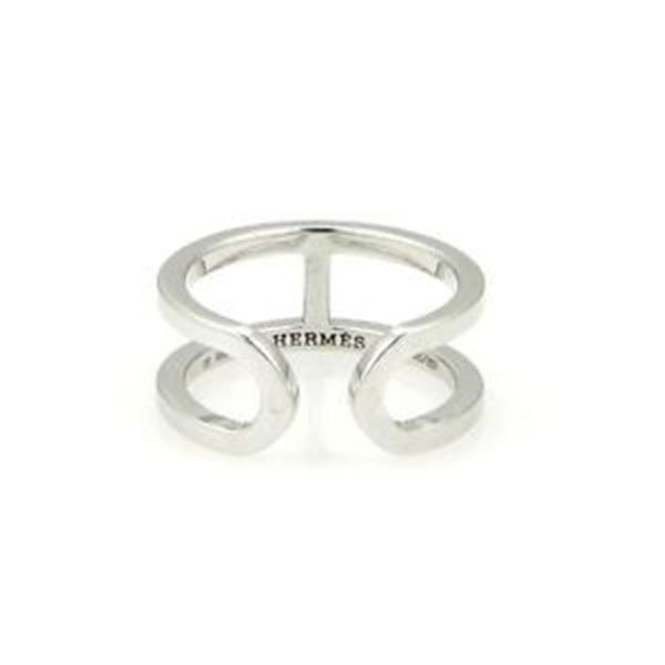 Hermes 18kt White Gold H Open Design Ring/Band Size 49: The is an elegant and beautiful ring by Hermes, from their H collection, this piece is crafted in solid 18kt white gold with a fine polished finish. It is in the style of a H in front with the round o