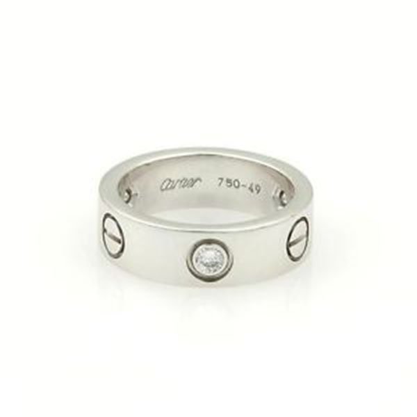 Cartier 18k WGold 3 Diamond Love Band/Ring 5.5mm Wide: Radiant refinement from the house of Cartier this gorgeous ring is crafted from solid 18k white gold with a fine polished finish and round cut sparkling diamonds. They are ideal for adding some sparkl