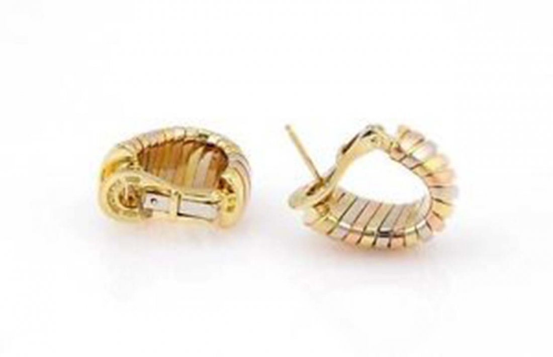 Bvlgari Bulgari 18K Tri Color Gold Tubogas Huggie: These authentic Bvlgari earrings are finely crafted from solid 18K tri color gold. These come from Bvlgari's ever so popular Tubogas collection. They feature the gorgeous Tubogas design in a tri color