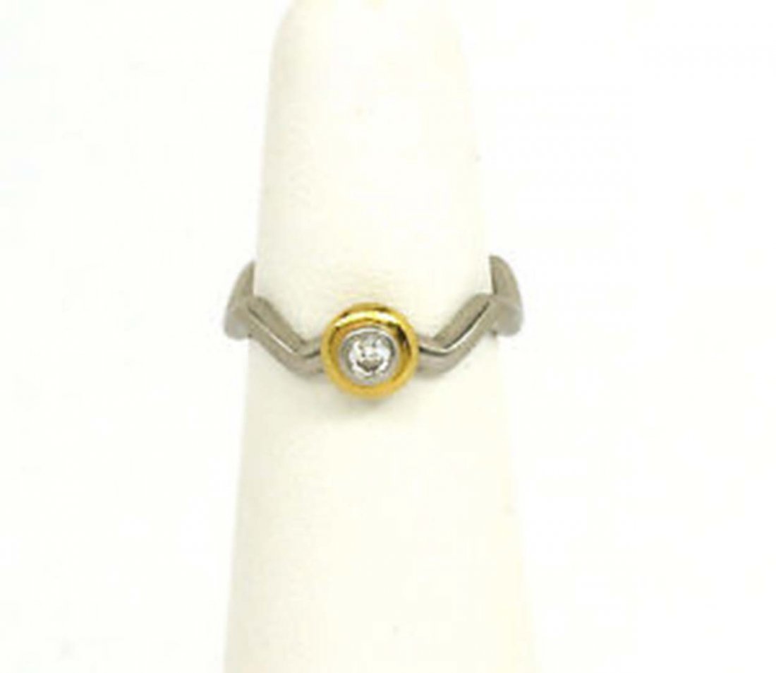 DESIGNER TIFFANY & CO. PICASSO PLATINUM & 18K LADIES: This is a designer Tiffany & Co. Paloma Picasso platinum and 18k gold ladies diamond solitaire band ring. The piece is well crafted in solid platinum adorned with a single seven point round cut loupe 