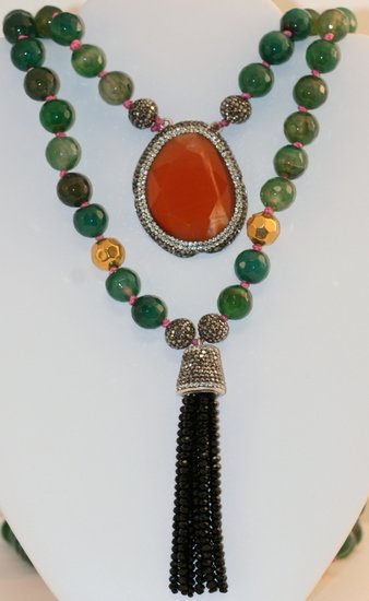 UNIQUE BEAUTIFUL LARGE JADE AND CATS EYE NECKLACE: UNIQUE BEAUTIFUL LARGE JADE AND CATS EYE NECKLACE. THIS STUNNING ONE OF A KIND DOUBLE STRAND NECKLACE IS MADE OF NATURAL JADE - TWO ROWS AND A LARGE CATS EYE CENTER PIECE.