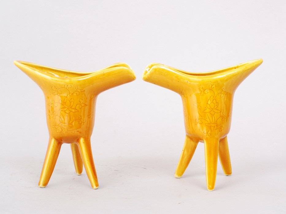 CHINESE MING STYLE WINECUPS: FINE YELLOW GALZED TRI-LEGS TEMPLE STYLE WINECUPS WITH FLORAL DESIGN UNDERGLAZE. BOTH 5"H,5"W. PRIVATE COLLECTION WEST BLOOMFIELD,MICHIGAN.
