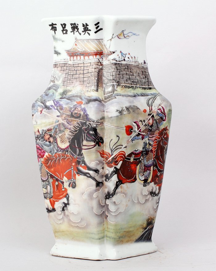 CHINESE FAMILLE ROSE PORCELAIN VASE: RHOMBIC SHAPE, FINELY PAINTED WITH CHINESE ANCIENT WAR SCENE IN FRONT OF A CASTLE,FIVE CHINESE CHARACTERS ON TOP NEARBY THE LIP. 15"H,9"W. SEAL MARK FOR QIANLONG PRODUCTION ON BOTTOM.