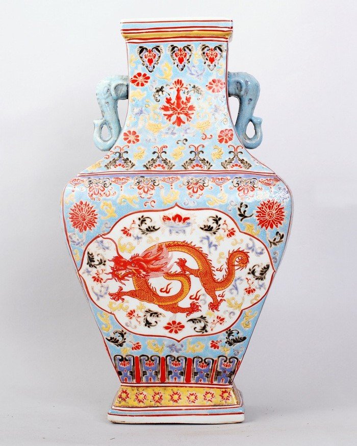 1109: FINE CHINESE QING FAMILLE ROSE PORCELAIN VASE: A FINE CLOISONNE VASE,DEPICTING A DRAGON AMONGST FLORAL PATTERNS IN THE CENTER PICTURE,SAME ON REVERSE.WITH TWO ELEPHANT HEAD HANDLE ON TOP. 17"H,9.5"W. SEAL MARK FOR YONGZHENG PRODUCTION UNDERSIDE.