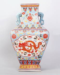 1109: FINE CHINESE QING FAMILLE ROSE PORCELAIN VASE: A FINE CLOISONNE VASE,DEPICTING A DRAGON AMONGST FLORAL PATTERNS IN THE CENTER PICTURE,SAME ON REVERSE.WITH TWO ELEPHANT HEAD HANDLE ON TOP. 17"H,9.5"W. SEAL MARK FOR YONGZHENG PRODUCTION UNDERSIDE.