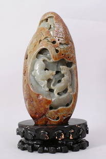 1111: A VERY FINE CINESE CARVED JHETIAN ZI ADE BOULDER: HETIAN ZI JADE WITH SUSSET SKIN CARVED TO DEPICT TWO TIGERS FIGHTING EACH OTHER IN THE FOREST, COMES WITH CARVED WOODEN STAND