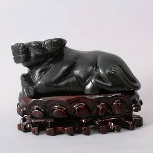 1083: CHINESE HETIAN JADE CARVING OF A WATER BUFFALO: VERY FINE HETIAN GREEN JADE CARVING COMES WITH WOOD STAND. QING, SIGNED QIANLONG