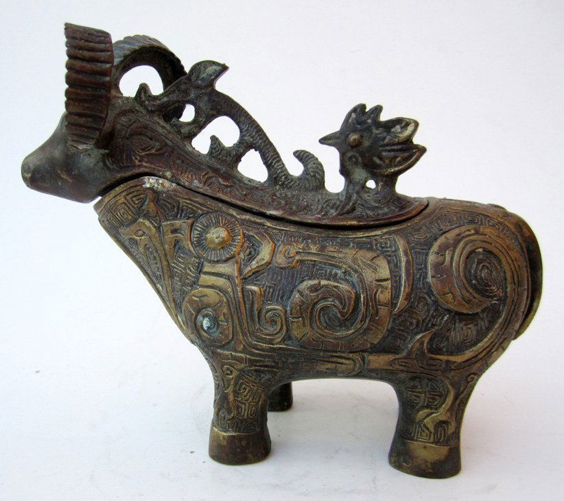 Chinese Bronze Ram Form Lidded Container: Measurements: 5 1/2''H, 6 1/2''L, 3''deep. Chinese archaic form vessel, lidded ram form. No mark. All base, stand or frame are not included unless it is in the title.