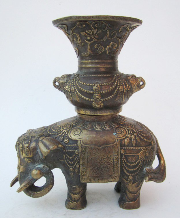 Chinese Bronze Elephant And Urn: Measurements: Size: 7 1/4''H, 6 1/2''W, 3 1/4''Deep. Chinese cast bronze two part elephant carrying a large urn on back, all with raised gilt highlights. Marked: each with impressed seal mark.All base