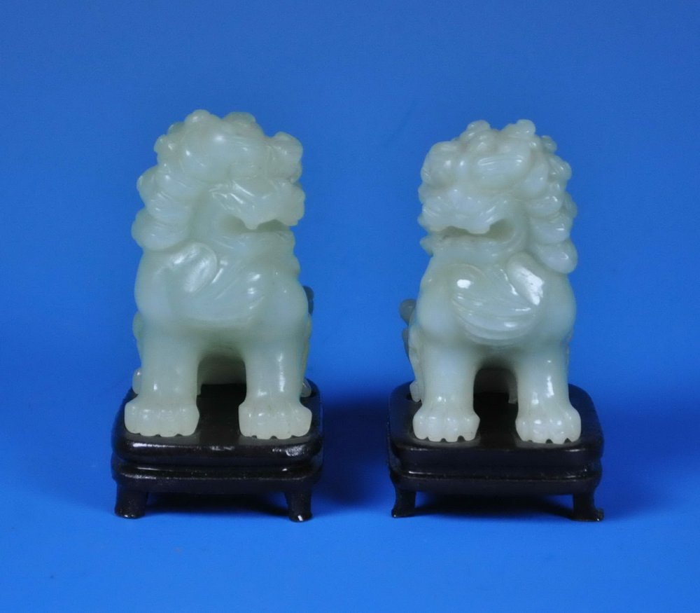 2 Chinese Carved Jade Foo Dogs w. Base: Measurements: 3" X 2" X 1.5" each, All the Jade we sell is real. They have all been tested with a GEM tester. They are not mixed material or fake.
