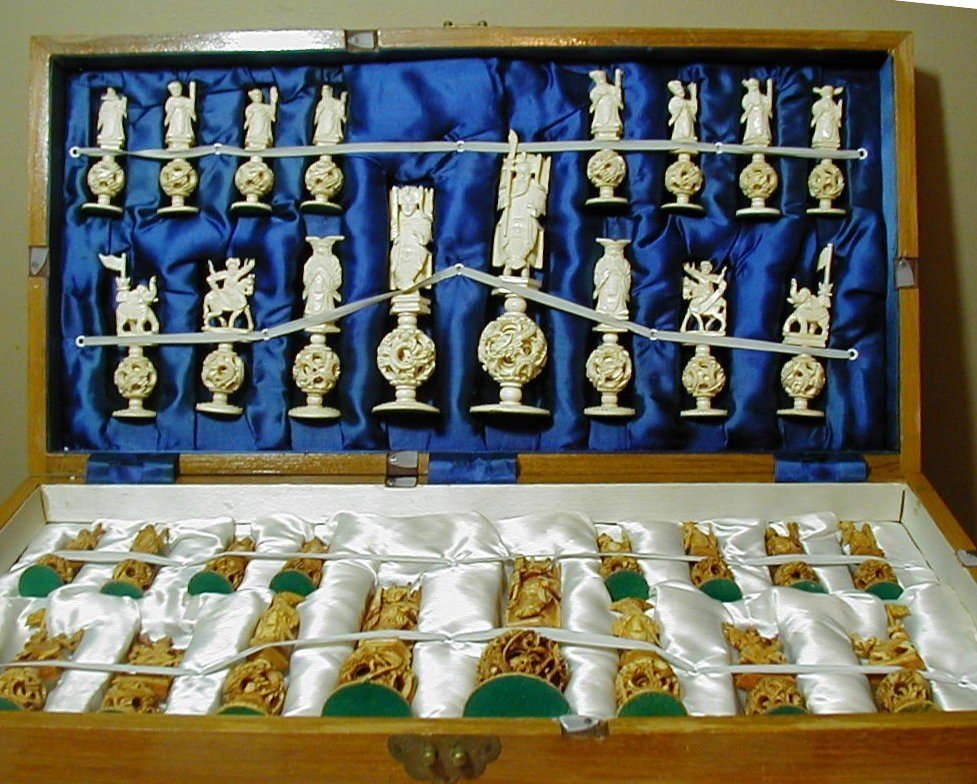 Chinese Carved Ivory puzzle ball chess set W,Box: This is for an antique Ivory Chinese puzzle ball chess set,in very nice condition. This is a complete set of 32 very large pieces, the kings are huge at an impressive 8" high and the hand carving is e