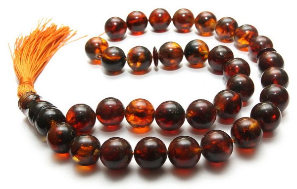 Baltic amber islamic rosary. 33 pressed beads: Measurements: L: 13",Bead diameter: 13 mm. Weight: 46g.