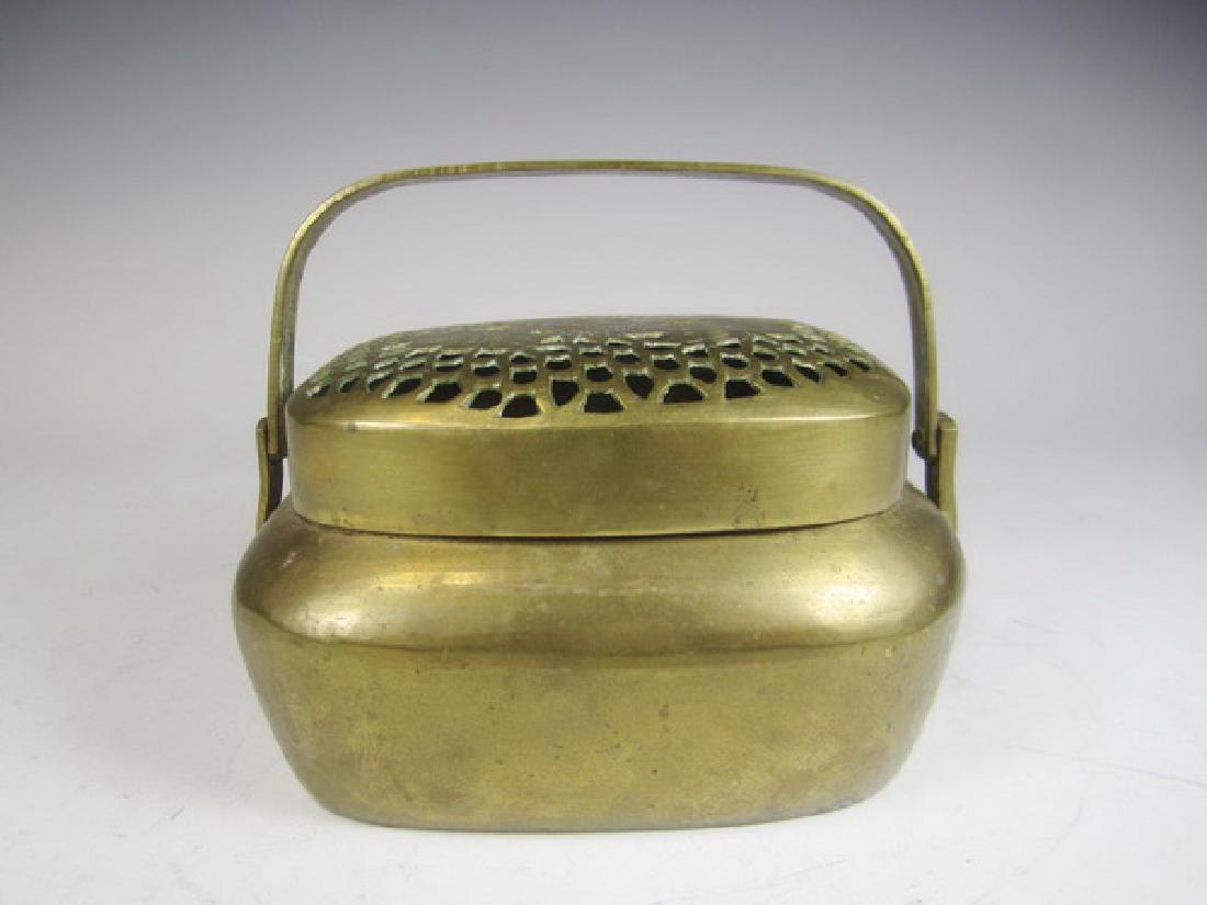 A CHINESE BRASS HAND WARMER (1 of 4)