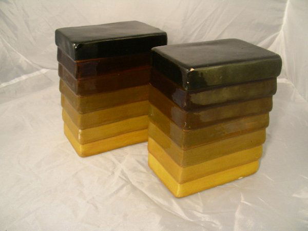 PAIR CERAMIC RAYMOR BOOKENDS MULTI COLORS: Lot # 409: PAIR CERAMIC RAYMOR BOOKENDS MULTI COLORS - Pair of Raymor bookends earth tones, gold, green and brown, 5 1/2" high by 4 1/4" wide, minor chips on one and a large chip on the other.