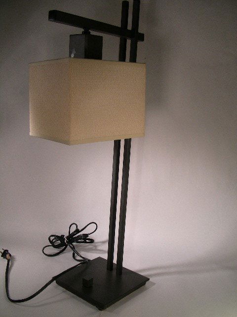 KOVACS ART DECO STYLE METAL DESK LAMP: Lot # 731: KOVACS ART DECO STYLE METAL DESK LAMP - Heavy metal base with woven shade. Measures 27 1/2" tall x 7" wide x 7" deep. Slight scratches on base. Small crease on one corner of shade. Good con